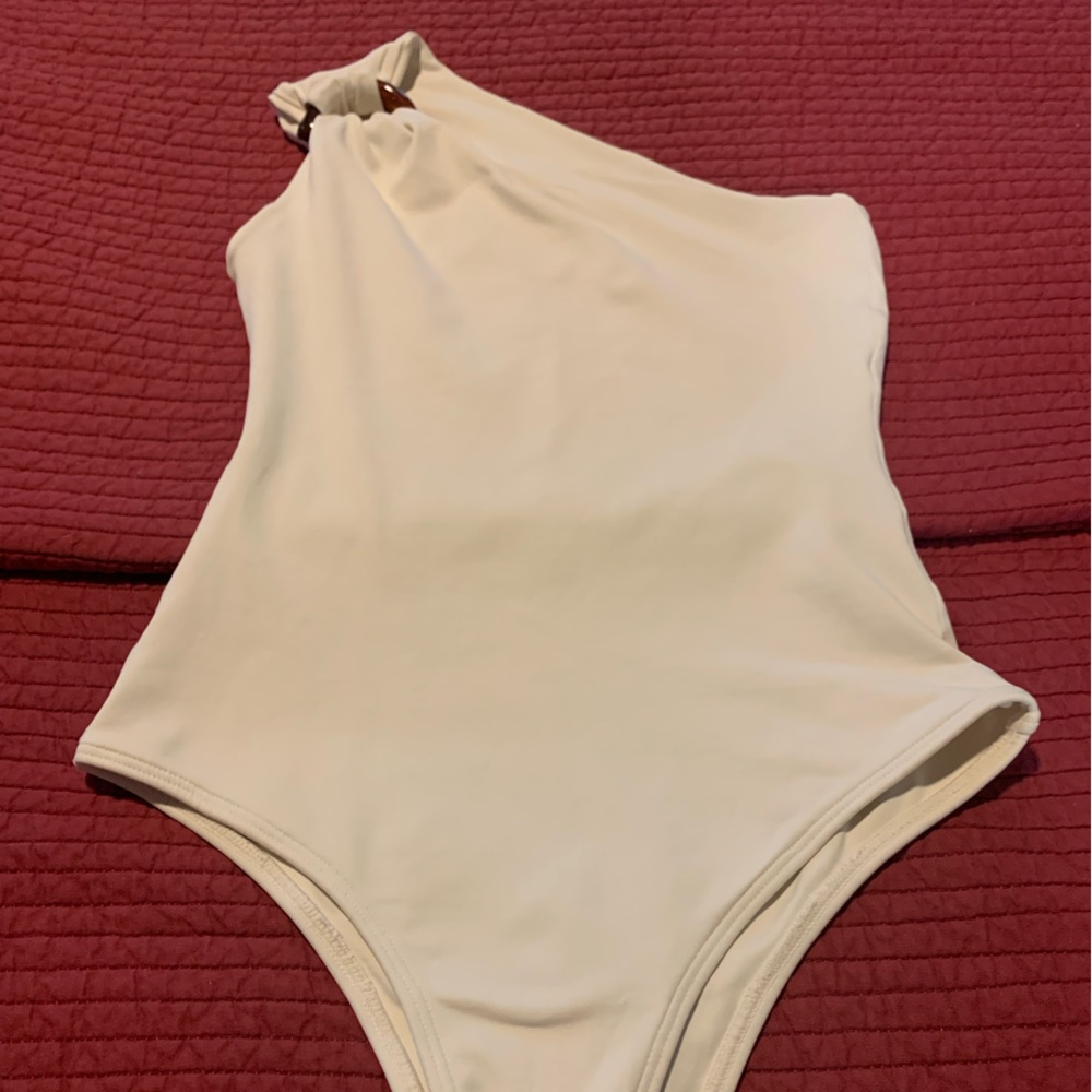 Ostra Brasil one shoulder one piece bathing suit.